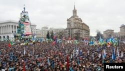 Supporters of EU integration are seen at a rally earlier in the day at Independence Square in central Kyiv, December 8, 2013.