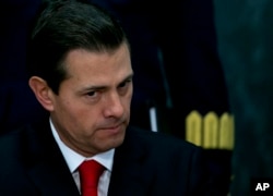 FILE - Mexico's President Enrique Pena Nieto makes a pause during a press conference at the Los Pinos presidential residence in Mexico City, Jan. 23, 2017.