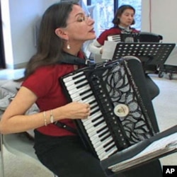 Joan Grauman, vice president of the Washington Metropolitan Accordion Society, performs with other accordion players during a celebration of the group's 8th anniversary.