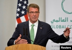 FILE - Former U.S. Secretary of Defense Ash Carter attends a press conference.