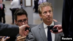 Senator Rand Paul, R-Kent., speaks to reporters as he arrives for a vote on Capitol Hill in Washington, Oct. 18, 2017.