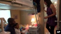 Ringmaster Jonathan Iverson at home on the train with his family.