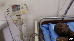 A man, who did not want to be identified, lies in a ward that specializes in the treatment of Aids at a hospital in Dakar, Senegal, Dec. 1, 2005.