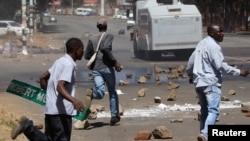 Opposition party supporters clash with police in Harare, Zimbabwe, Aug. 26, 2016.
