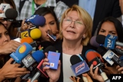 FILE - Venezuela's attorney general Luisa Ortega speaks to journalists outside the Supreme Court of Justice headquarters building in Caracas, June 13, 2017.