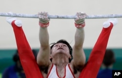 Japan's Kohei Uchimura performs on the horizontal bar during the artistic gymnastics men's team final at the 2016 Summer Olympics in Rio de Janeiro, Brazil, Monday, Aug. 8, 2016.