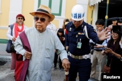 Sulak Sivaraksa arrives for a court hearing where Thailand's military prosecutor will decide whether to proceed with a lese majeste case against him, in Bangkok, Thailand, Jan. 17, 2018.