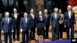 Indonesia Leaders of the Asia-Pacific region stand for a group photo session during the Asia-Pacific Economic Cooperation (APEC) forum in Bali, Indonesia, Tuesday, Oct. 8, 2013.