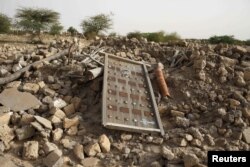 FILE - The rubble left from an ancient mausoleum destroyed by Islamist militants, is seen in Timbuktu, Mali, July 25, 2013.