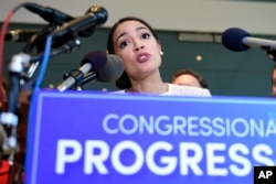 Rep.-elect Alexandria Ocasio-Cortez, Democrat-New York, talks during a news conference with members of the Progressive Caucus in Washington, Nov. 12, 2018.