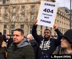 Protester brandishing sign saying 'president not found' in reference to aging and frail leader Abdelaziz Bouteflika.