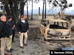 President Donald Trump surveys the damage done by the Woolsey Fire in Malibu, Calif., Nov. 17, 2018. At left is Congressman Kevin McCarthy, who represents a nearby district.
