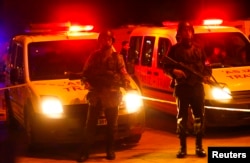 Turkish soldiers stand guard near the site of an explosion in Ankara, Feb. 17, 2016.