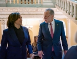 Senate Minority Leader Chuck Schumer, D-N.Y., joined by Sen. Kamala Harris, D-Calif., prepares to speak to reporters in Washington, Jan. 31, 2020.