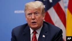 President Donald Trump speaks to media at the G-20 summit, in Buenos Aires, Argentina, Dec. 1, 2018. 