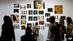 People attend the ArtRio International Art Fair in Rio de Janeiro, Brazil, Sept. 9, 2015. 