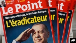 The cover of Le Point, a French weekly political magazine, featuring Turkish President Recep Tayyip Erdogan and the headline "The eradicator," is on display at a newsstand in Paris, Oct. 25, 2019. 