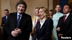 Italian Prime Minister Giorgia Meloni and Argentina's President Javier Milei arrive for the inauguration of Donald Trump at the Rotunda of the U.S. Capitol in Washington, Jan. 20, 2025.