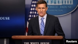 FILE - National security adviser General Michael Flynn delivers a statement during a briefing at the White House in Washington, Feb. 1, 2017.
