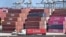Shipping containers are stacked high at the Port of Long Beach on March 4, 2025 in Long Beach, California, as US President Donald Trump's tariffs on Canada and Mexico take effect.