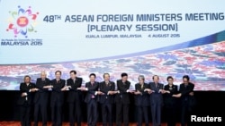 ASEAN foreign ministers pose for group photo in Kuala Lumpur, Malaysia, Aug. 4, 2015. 