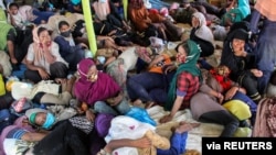 Rohingya refugees are seen resting in Lhokseumawe, Aceh province, Indonesia, Sept. 7, 2020, in this photo taken by Antara Foto/Rahmad/via Reuters.