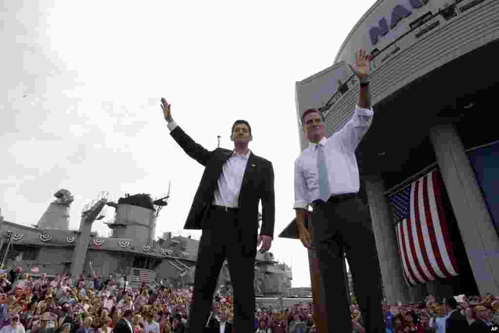 Republican presidential candidate, former Massachusetts Gov. Mitt Romney, right, and vice presidential candidate Wisconsin Rep. Paul Ryan, R-Wis., wave at the crowd during a campaign event, Aug. 11, 2012 in Norfolk, Va.