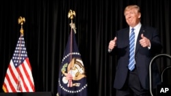 President Donald Trump gives a thumbs up as he arrives to speak to the Major County Sheriffs' Association and Major Cities Chiefs Association, Wednesday, Feb. 8, 2017, in Washington. (AP Photo/Evan Vucci)