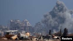 Smoke rises from an explosion in Gaza, as seen from Israel on Aug. 23, 2024.