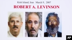 FILE- An FBI poster showing a composite image of former FBI agent Robert Levinson (right) of how he would look like now after five years in captivity, and an image (center) taken from the video, released by his kidnappers, and a picture before he was kidnapped displayed during a news conference in Washington. It’s been 10 years since former FBI agent Robert Levinson disappeared while in Iran.