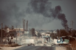 A checkpoint, abandoned by Syrian Democratic Forces after Turkish military operations began last week, pictured on Oct. 11, 2019, outside Ras al-Ayn, Syria. (A. Lourie/VOA)