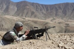 FILE - An Afghan security forces member takes part in a military operation in Jurm district, Badakhshan province, Afghanistan, March 31, 2018.