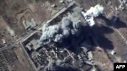 An Oct.12, 2015, image grab from a video made available on the Russian Defense Ministry's official website, purports to show explosions resulting from Russian airstrikes against targets in the Syrian province of Idlib.