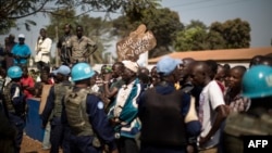Residents of the PK5 district rally in front of the MINUSCA, the United Nations mission in Central African Republic's headquarters, calling for more security measures during a constitutional referendum, in the flashpoint enclave in Bangui, on Dec. 13, 2015.
