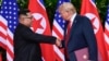 FILE - In this June 12, 2018, file photo, North Korea leader Kim Jong Un, left, and U.S. President Donald Trump shake hands at the conclusion of their meetings at the Capella resort on Sentosa Island in Singapore. 
