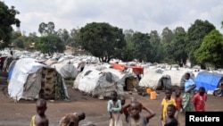 FILE - Congolese children are seen at a makeshift camp for internally displaced people in Bunia, Ituri province, eastern Democratic Republic of Congo, June 25, 2019.