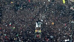 Coffins of Gen. Qassem Soleimani and others who were killed in Iraq by a U.S. drone strike, are carried on a truck surrounded by mourners during a funeral procession, in the city of Mashhad, Iran, Jan. 5, 2020.