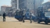 Anti-riot policemen deploy across Conakry to separate rival gang fighters, March 1, 2013.