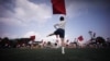 Students practice flag cheering routines at a Tokyo Korean junior and senior high school in Tokyo, Sept. 26, 2017. 