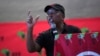 FILE - Economic Freedom Fighters opposition party leader Julius Malema addresses supporters and volunteers near Durban, South Africa, on Feb. 8. 2024. The fiery populist politician has been charged with hate speech and for firing a gun at a public rally.