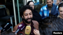 FILE - Journalist and activist Omar Radi speaks to the media outside court in Casablanca, Morocco, March 12, 2020. On July 29, 2024, Radi was pardoned after being detained since 2021 on sexual assault charges he denied. 