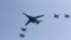 FILE - A U.S. B-1 bomber, center, flies over Osan Air Base with U.S. jets in Pyeongtaek, South Korea, Tuesday, Sept. 13, 2016.