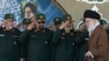 FILE - Ayatollah Ali Khamenei arriving at a graduation ceremony of the Revolutionary Guard's officers, as the deputy commander of the Guard, Hossein Salami (2nd R) and other salute him in Tehran. (Office of Iranian Supreme Leader via AP)