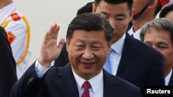 FILE - China's President Xi Jinping arrives for the APEC Summit in Danang, Vietnam, Nov. 10, 2017.