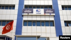 A tunisian flag flutters outside the building of the moderate Islamist Ennahda party headquarters in Tunis, Tunisia, July 29, 2021.