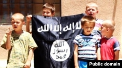 Bosnian children with an Islamic State flag are seen in an IS video. 