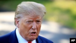 President Donald Trump speaks to reporters before leaving the White House, Sept. 16, 2019, in Washington. 