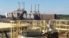 In 2011, Duke Energy shuttered its coal-fired power plant, at rear, and opened a new plant that runs on natural gas. Its water-treatment facility appears, in foreground, in Rowan County, North Carolina. (N. Yaqub/VOA)