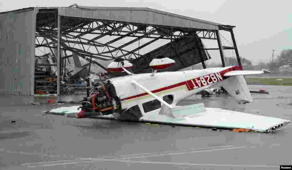 A plane lies upside down at the airport after Hurricane Harvey struck near Fulton, Texas, Aug. 26, 2017.