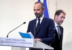 French Prime Minister Edouard Philippe, left, and French Minister of the Interior Christophe Castaner at a press conference at the Hotel Matignon in Paris, Nov. 6, 2019. Next year, France will start setting quotas on migrant labor.